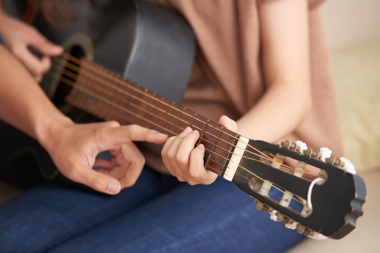 Attending guitar class